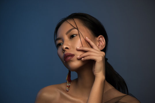Studio portrait of young beautiful asian woman