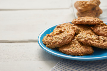 fresh baked chetnuts on plate on wooden table