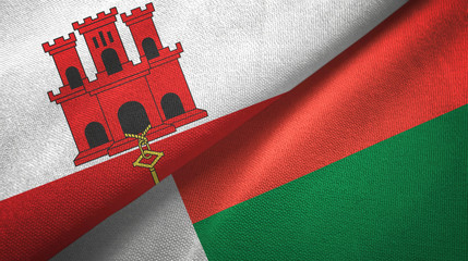 Gibraltar and Madagascar two flags textile cloth, fabric texture