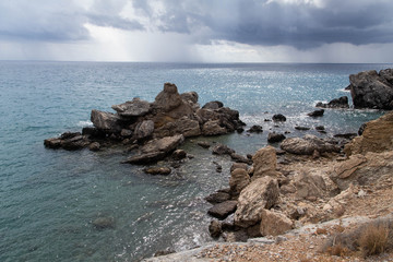 Fototapeta na wymiar Waves beat on the rocks near the sea shore