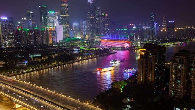 Guangzhou Pearl river bridge at night in China timelapse zoom out