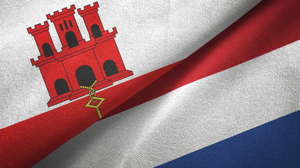 Gibraltar and Netherlands two flags textile cloth, fabric texture