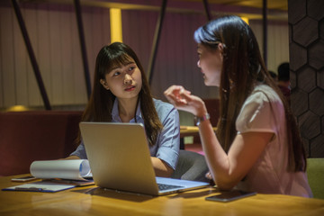 Asian businesswoman working over time, discuss about work