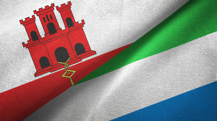 Gibraltar and Sierra Leone two flags textile cloth, fabric texture