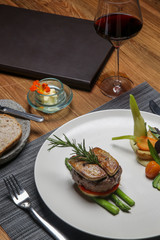 Pan seared tenderloin served with steamed vegetables. Exquisite dish. Creative restaurant meal concept.	
