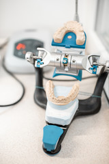 Dental articulator with jaw model on the table at the laboratory