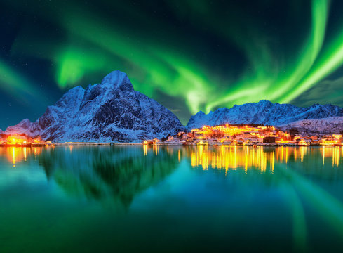 Aurora borealis over winter landscape - lofotens - Norway