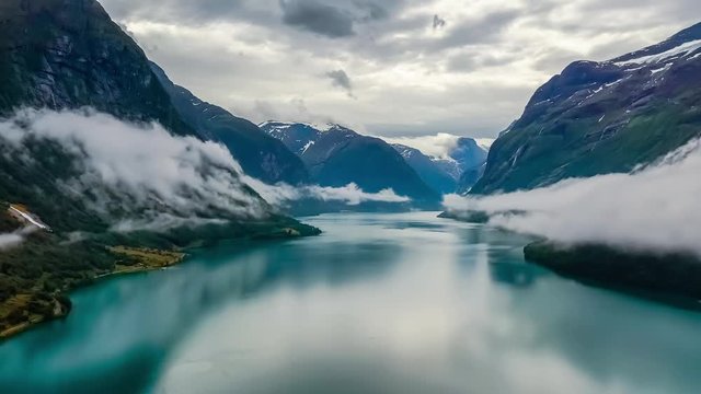 Beautiful Nature Norway natural landscape lovatnet lake flying over the clouds.