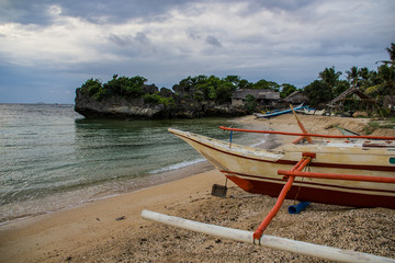 Fototapeta na wymiar The village hidden among the rocks - Carabao Island (philippines)