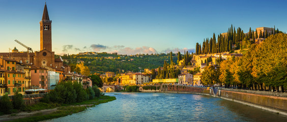 Verona cityscape during late sunset with Adige river and Church Complesso della Cattedrale-Duomo, viewed from the opposite side of river. Verona is located in Veneto, Italy,