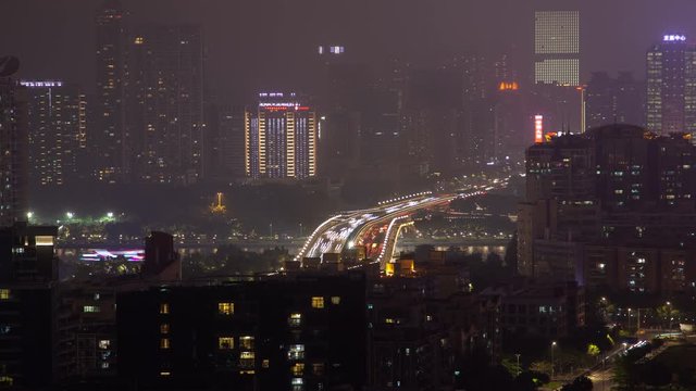 Night illuminated Guangzhou highway in China timelapse zoom out