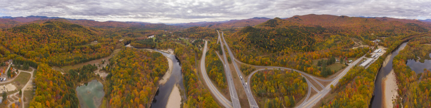 Interstate Highway 93 at Exit 30 with US Route 3 and Pemigewasset River in White Mountain National Forest panorama aerial view with fall foliage, Town of Thornton, New Hampshire NH, USA. © Wangkun Jia