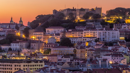 Naklejka premium Lisbon aerial cityscape skyline night to day timelapse from viewpoint of St. Peter of Alcantara, Portugal