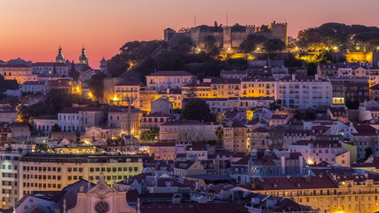 Naklejka premium Lisbon aerial cityscape skyline night to day timelapse from viewpoint of St. Peter of Alcantara, Portugal