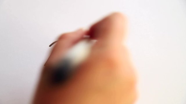 Hand writing Bonds up on white paper