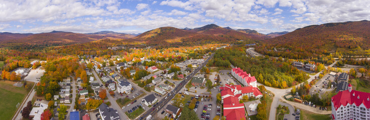 Lincoln Main Street at town center and Little Coolidge Mountain on Kancamagus Highway panorama aerial view with fall foliage, Town of Lincoln, New Hampshire NH, USA. - obrazy, fototapety, plakaty