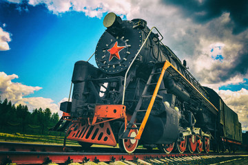vintage steam train on the rails, close-up, retro vehicle, steam engine, toned