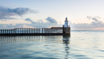 View of Blyth Harbour Piers, Blyth on the coast of Northumberland, England, UK. At sunrise on a...