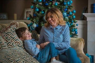 Nice mom and little boy at Christmas time, children and parents lifestyle