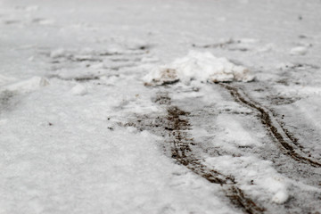 tracks in the snow on the road