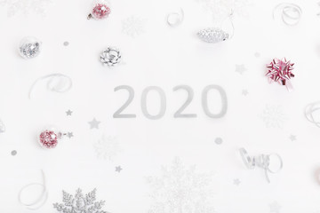 Christmas holiday composition. Festive creative gold silver pattern with ribbon on white background.