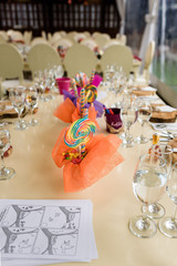 Setting or a kids table with lollipops