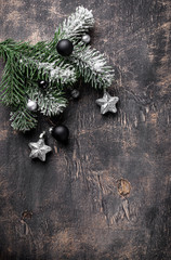 Christmas dark background with branch of tree