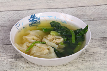 Asian traditional Wonton soup with herbs