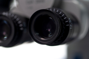 Obraz na płótnie Canvas Close-up of black binoculars on a table