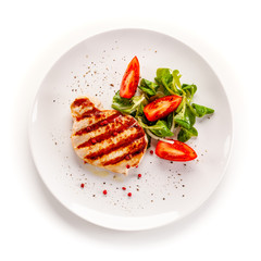 Grilled steak with vegetable salad on white background
