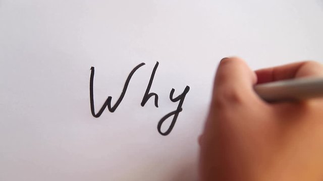 Hand writing Why? on white paper