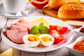 Continental breakfast on wooden table
