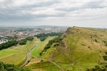 Landscape of Edinburgh city in Scotland viewed from Arthurs Seat in cloudy weather