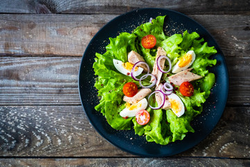Tuna salad on wooden table