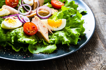 Tuna salad on wooden table