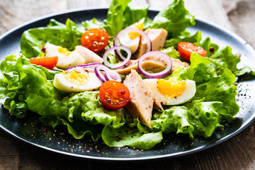 Tuna salad on wooden table