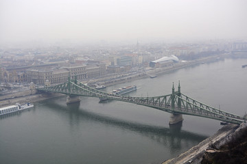 Fototapeta premium Liberty Bridge or Freedom Bridge in Budapest, Hungary, a foggy and rainy day