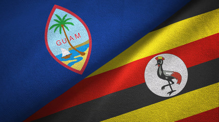 Fototapeta premium Guam and Uganda two flags textile cloth, fabric texture