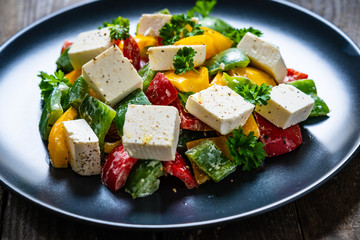  Fresh greek salad on wooden background