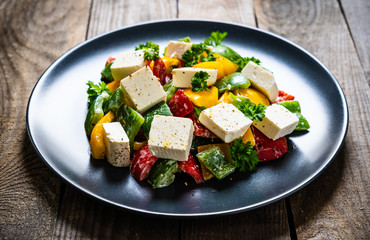  Fresh greek salad on wooden background