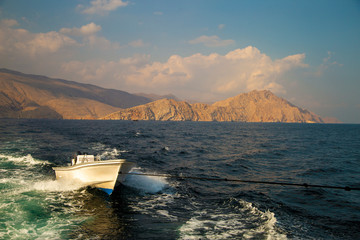 boat in the sea on a background of mountains
