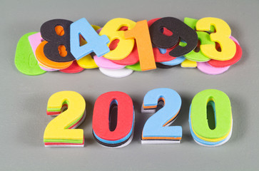 2020 in multicolored figures on gray background