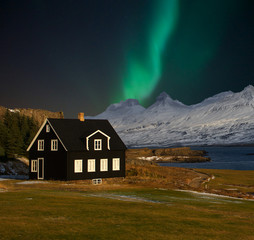 Iceland black house with aurora borealis Northern Light in winter at night the best photo