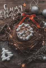 hot coffee on wooden background and Christmas wreath