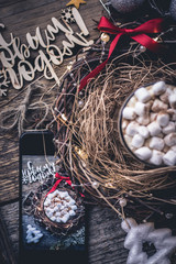 hot coffee on wooden background and Christmas wreath