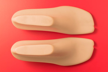 A Shoe tree on red background