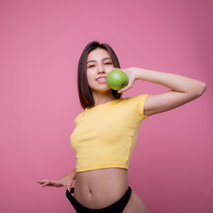 Portrait asian woman smile holding and eating green apple fruit and beautiful body diet with fit isolated on white background, girl weight slim with cellulite or calories, health and wellness concept.