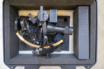 Ship's sextant in a package. Navigation measuring device. Protect your device from shocks. Ship equipment. Measuring device in shipping. Assistance to mariners.