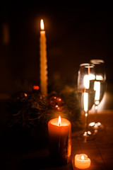 Christmas champagne on a table against the background of garlands