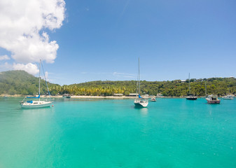 Small boats bringing tourists at Honeymoon Beach on St John - US Virgin Islands, 2019